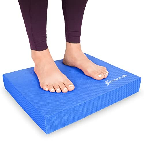 Person standing on blue balance stability pad