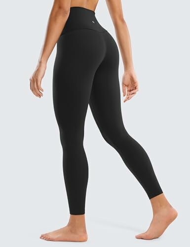 Person wearing black high-waist leggings