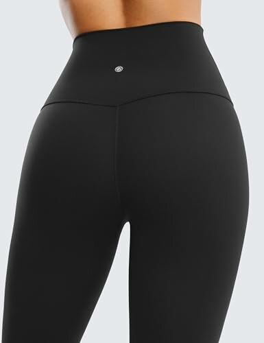 Back view of black high-waisted leggings.