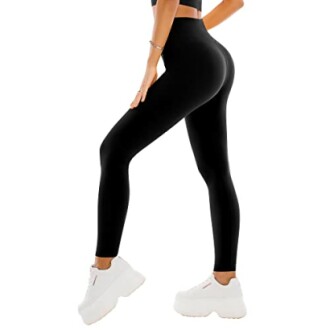 Person wearing black leggings and white sneakers