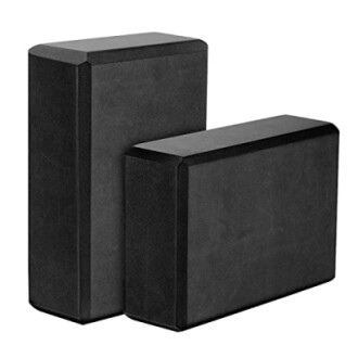 Two black yoga blocks in different sizes.