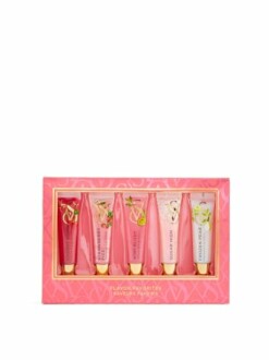 Set of six flavored lip gloss tubes in a pink box.