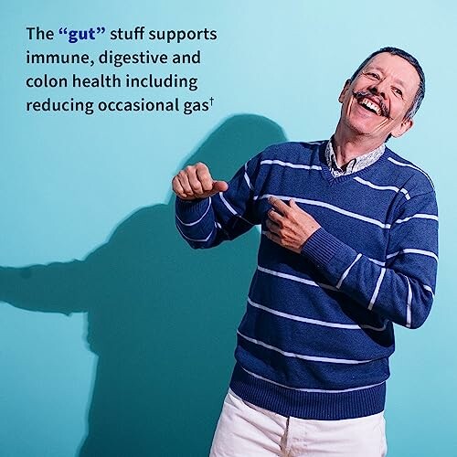 Smiling man in blue sweater with health message on blue background.