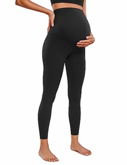 Pregnant woman wearing black maternity leggings