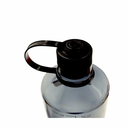 Close-up of a plastic bottle with a black cap
