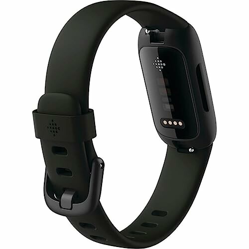 Black fitness tracker watch with green strap