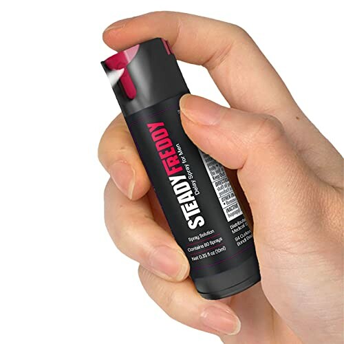Hand holding a Steady Freddy delay spray bottle