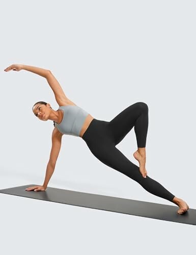 Woman performing a yoga pose on a mat