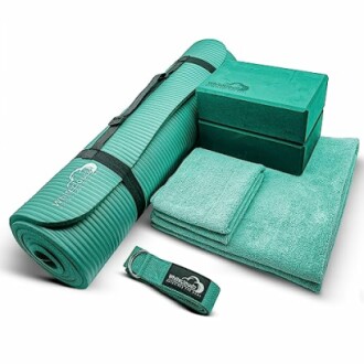 Green yoga set with mat, blocks, towel, and strap.